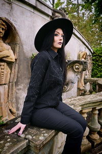 Vintage-inspired black work jacket with subtle black-on-black web embroidery across the chest, sleeves and back, modelled on a 1950s dead stock jacket design, featuring two side-seam zip pockets and a hidden interior pocket for secure essentials, perfect for transitional fall and spring layering.