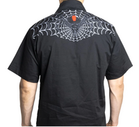 The Black Widow Western Shirt features a striking coffin-inspired black widow graphic printed across the shoulders and back. Its short-sleeve design is crafted from a comfortable cotton-poly blend for breathability and easy wear. Black snap buttons and front pockets add traditional western details, while the bold monochrome spider design creates a dark, gothic statement perfect for alternative and spooky western wardrobes.
