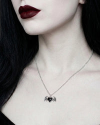 Black enamel and pewter gothic heart necklace with detailed bat wings, antique finish, decorative pendant design, and a silver-tone 18-inch chain created as an alternative fashion accessory.