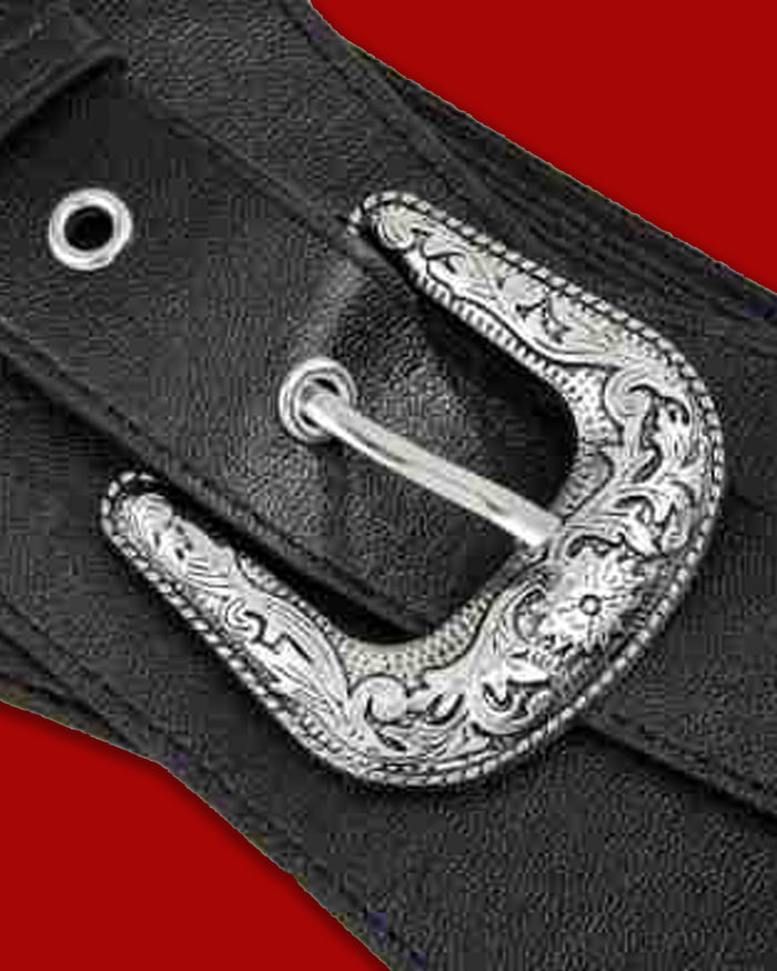 A striking western gothic cinch belt with a structured black synthetic leather front and an overlapping silhouette that defines the waist. The Dark Rodeo Belt is decorated with silver grommets and a large silver-toned metal buckle featuring intricate floral engraving. Its wide elastic back band offers comfortable stretch, while the functional front buckle makes it easy to adjust the fit.