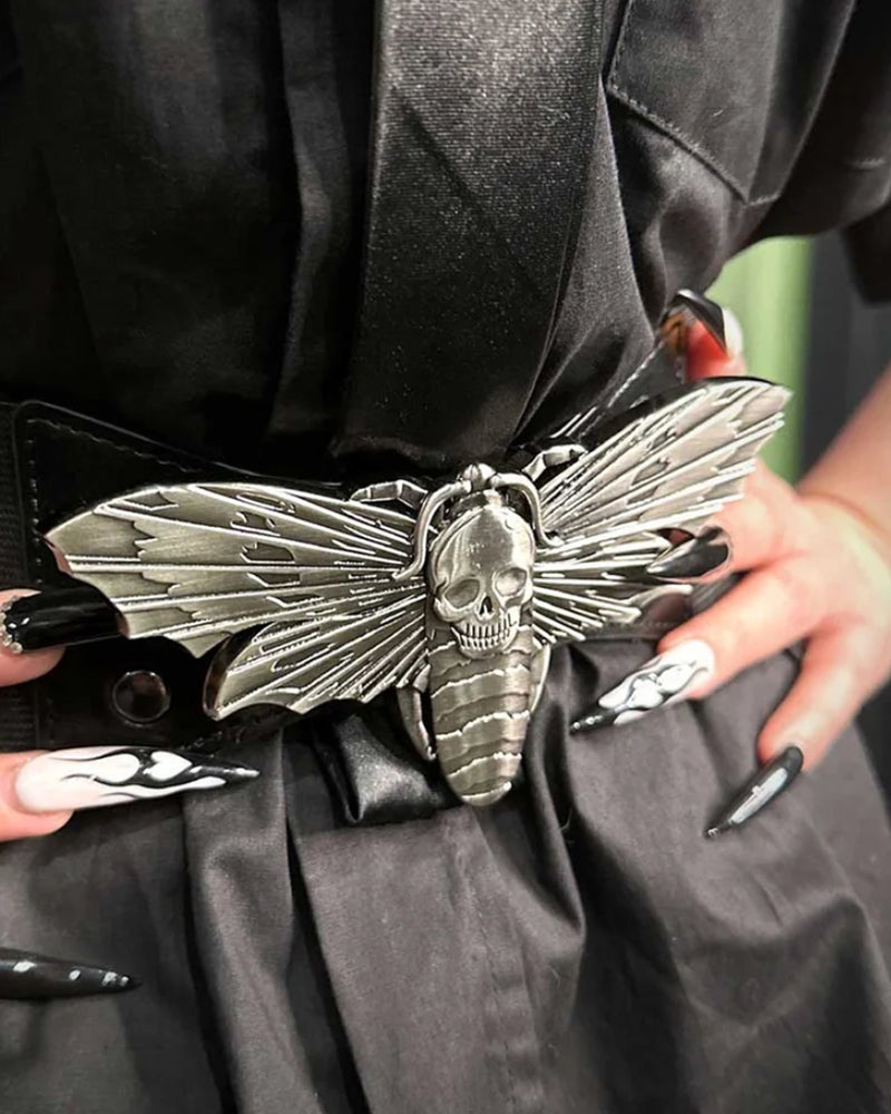 The Elastic Moth Waist Belt features a vintage-inspired design with soft, high-stretch elastic that comfortably cinches the waist for a flattering silhouette. A striking death’s head hawkmoth buckle takes center stage, finished in antique pewter-toned metal alloy. The interlocking buckle provides a secure fit while adding an intricate gothic touch, making this belt a statement accessory for dark romantic, alternative, or everyday outfits.