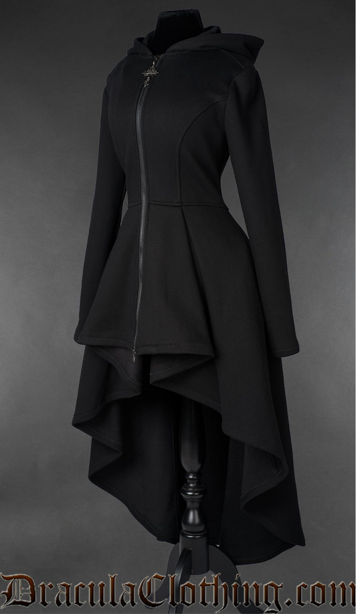 A heavyweight black cotton hoodie featuring a striking long high-low silhouette and oversized hood. Crafted from 100% cotton at 400 GSM, the thick fabric is soft and warm with a fleece lining inside. Corset-style lacing across the back adds gothic detail, while deep pockets and a black front zipper provide practical functionality. A cross-shaped zipper pull completes the dark romantic design.