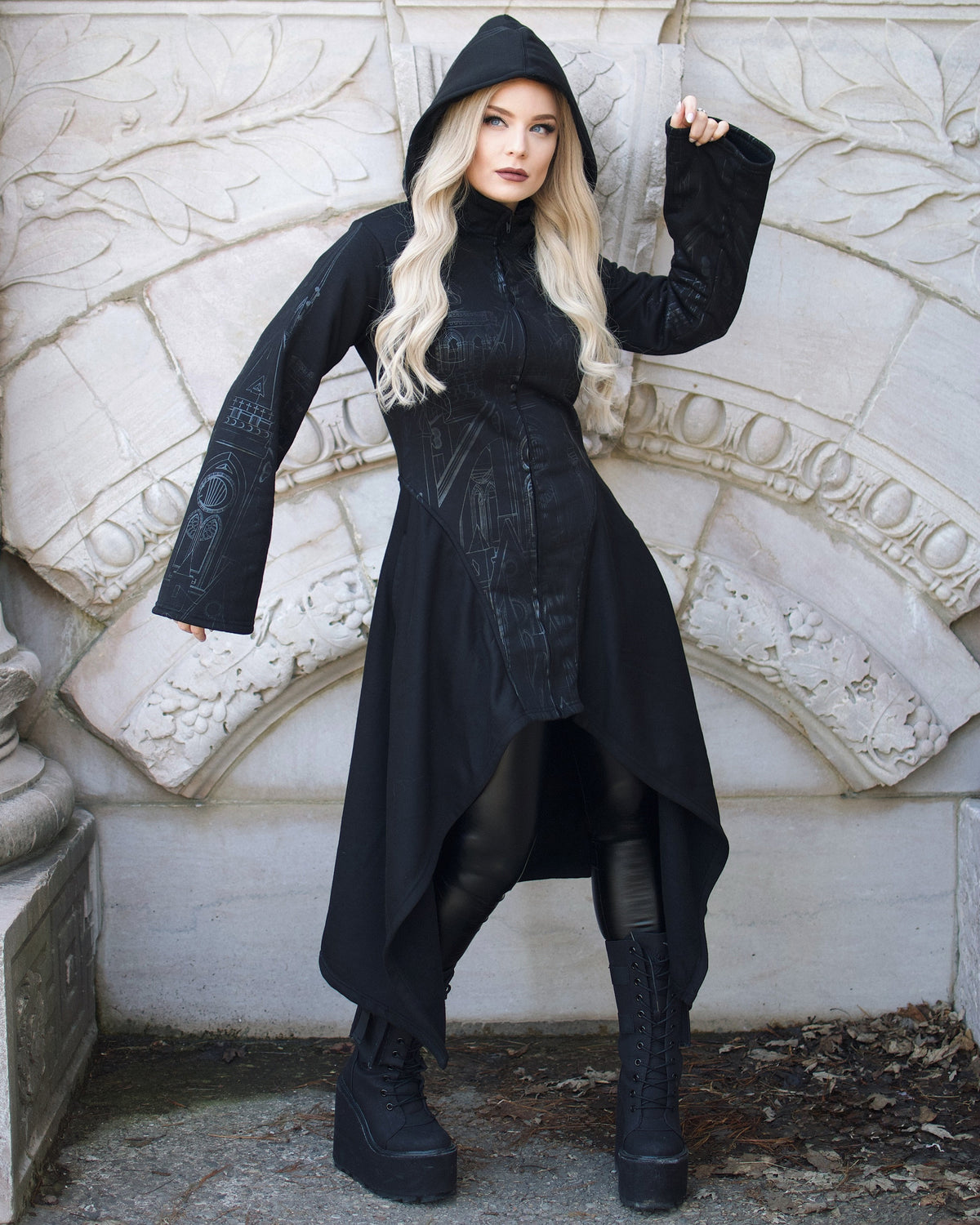 Dramatic Vixxsin hoodie with silver cathedral design, corset back, and asymmetric hem. Oversized hood and deep pockets complete this edgy gothic streetwear piece.