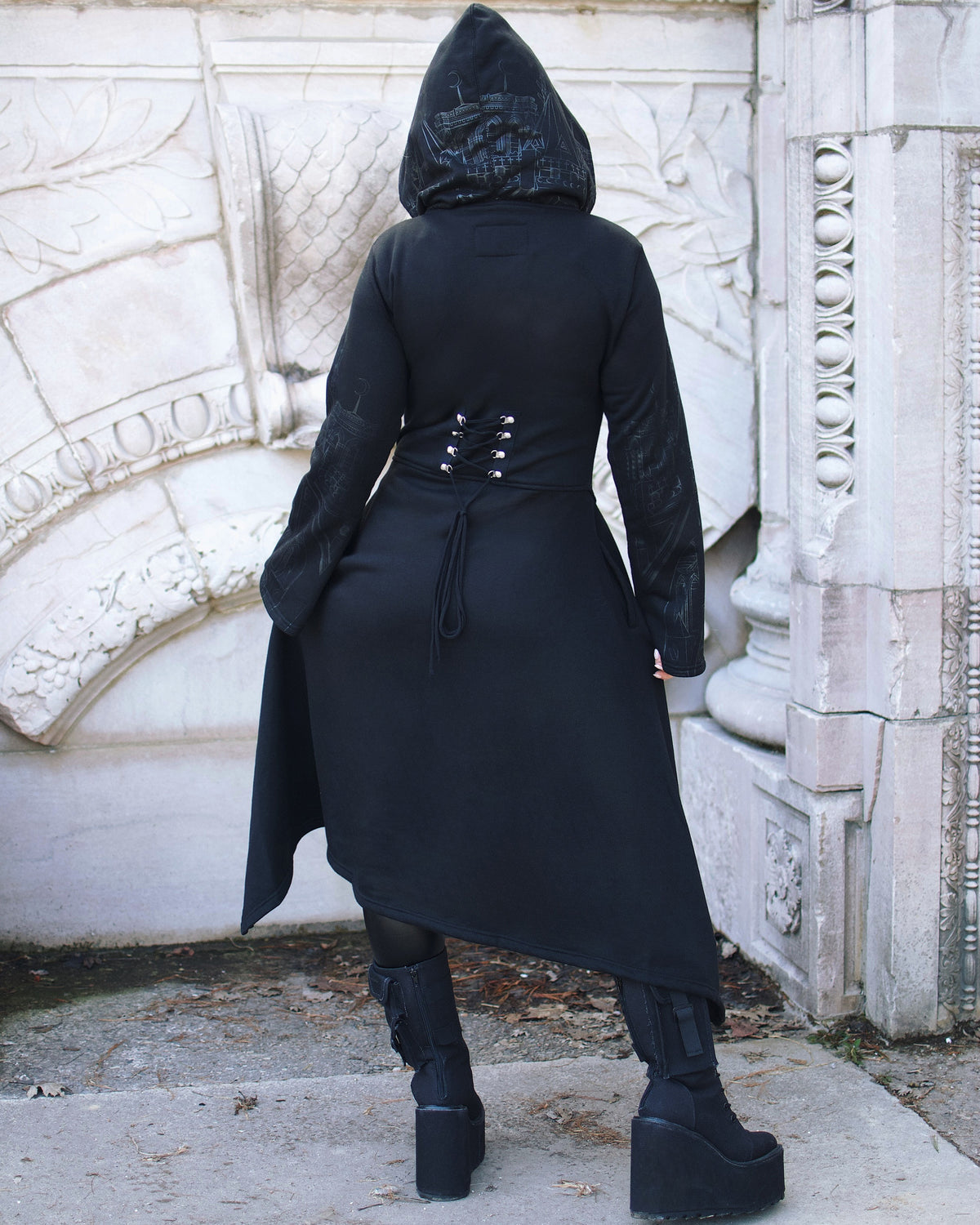 Relaxed fit Vixxsin hoodie with striking silver cathedral graphics, asymmetric hem, corset detail, wide cuffs, and oversized hood. Perfect gothic-inspired statement piece.