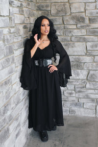 A flowing Renaissance maxi dress with an elegant off-shoulder neckline and wide bell sleeves for a dramatic, romantic silhouette. The smocked waist provides a comfortable, flattering fit without feeling restrictive, while the long skirt creates graceful movement. Perfect for Renaissance fairs, fantasy photoshoots, cosplay, LARP, pirate festivals, garden weddings, and music festivals, or paired with boots and a corset belt.