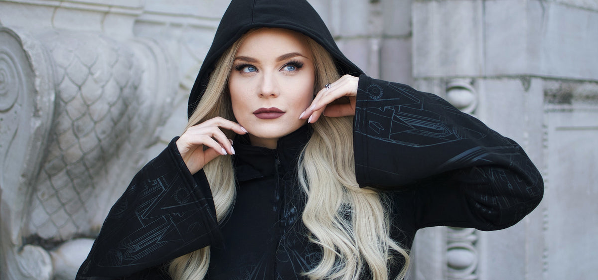 Vixxsin oversized hoodie with silver cathedral print across front and sleeves, corset-style back, and dramatic asymmetric hem. Comfortable cotton-poly blend for streetwear style.