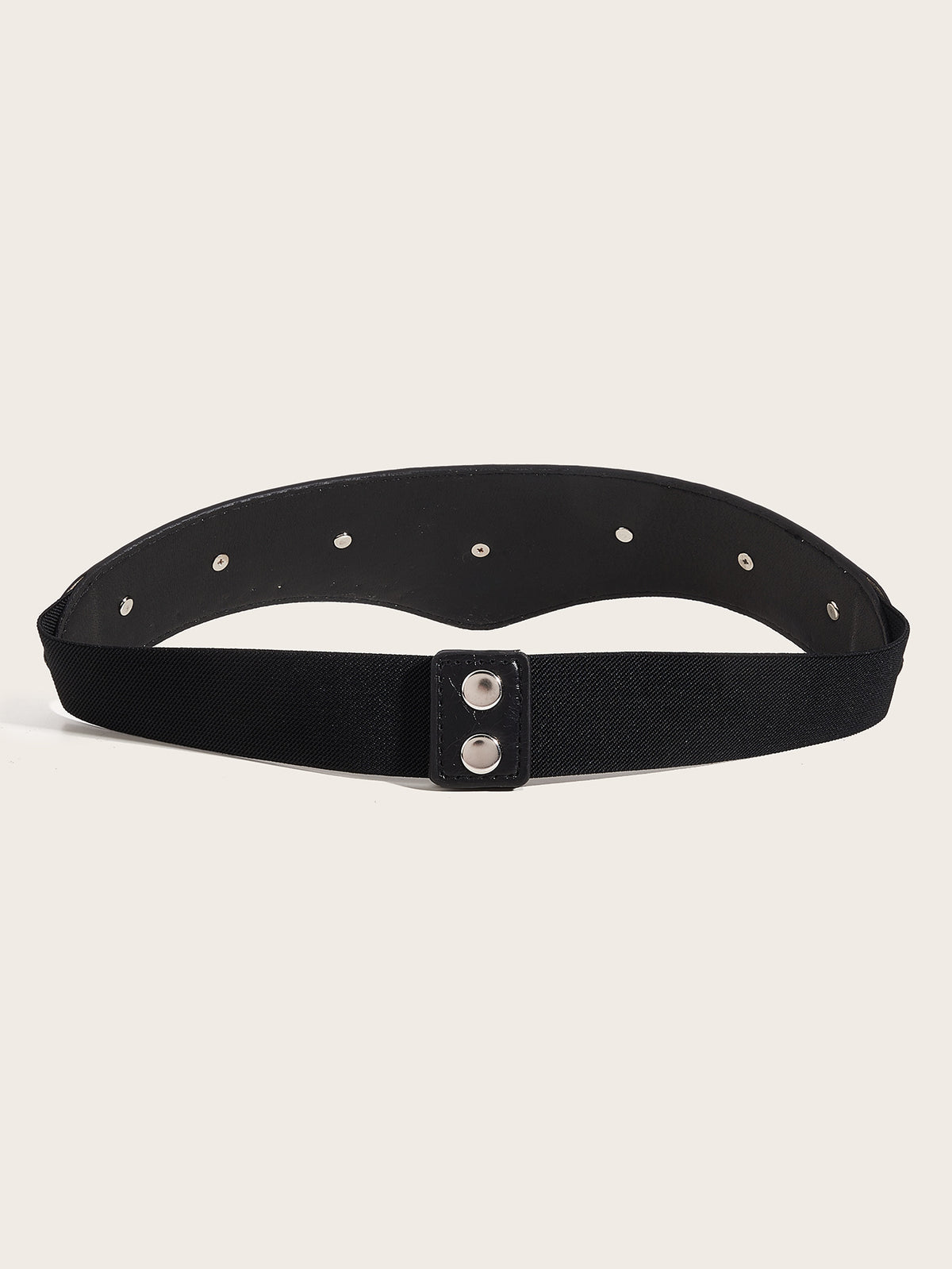 A dramatic western-inspired belt featuring a V-shaped textured synthetic leather front adorned with detailed silver-toned hearts and crosses. Designed to create a flattering, slimming appearance, the Wild Heart Belt draws the eye inward at the waist while adding bold character to an outfit. Its wide elastic stretch back ensures comfort and flexibility, finished with secure double snap closures for easy wear.