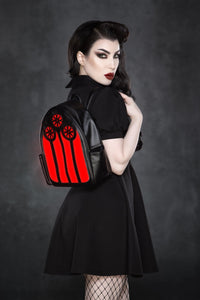 A gothic-inspired vegan leather LED backpack featuring a striking stained glass window design that illuminates in vibrant red, green, and purple tones or switches to a sleek black-and-white mode. Perfect for festivals, school, or everyday adventures, this stylish accessory blends spooky cathedral aesthetics with modern tech flair.