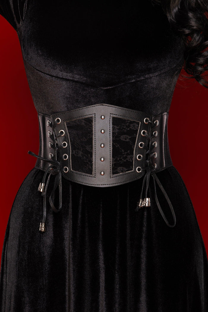 Black lace corset belt with vegan leather panels and stretch back, designed to cinch the waist and elevate dresses, blazers, or oversized shirts with a bold, feminine silhouette.