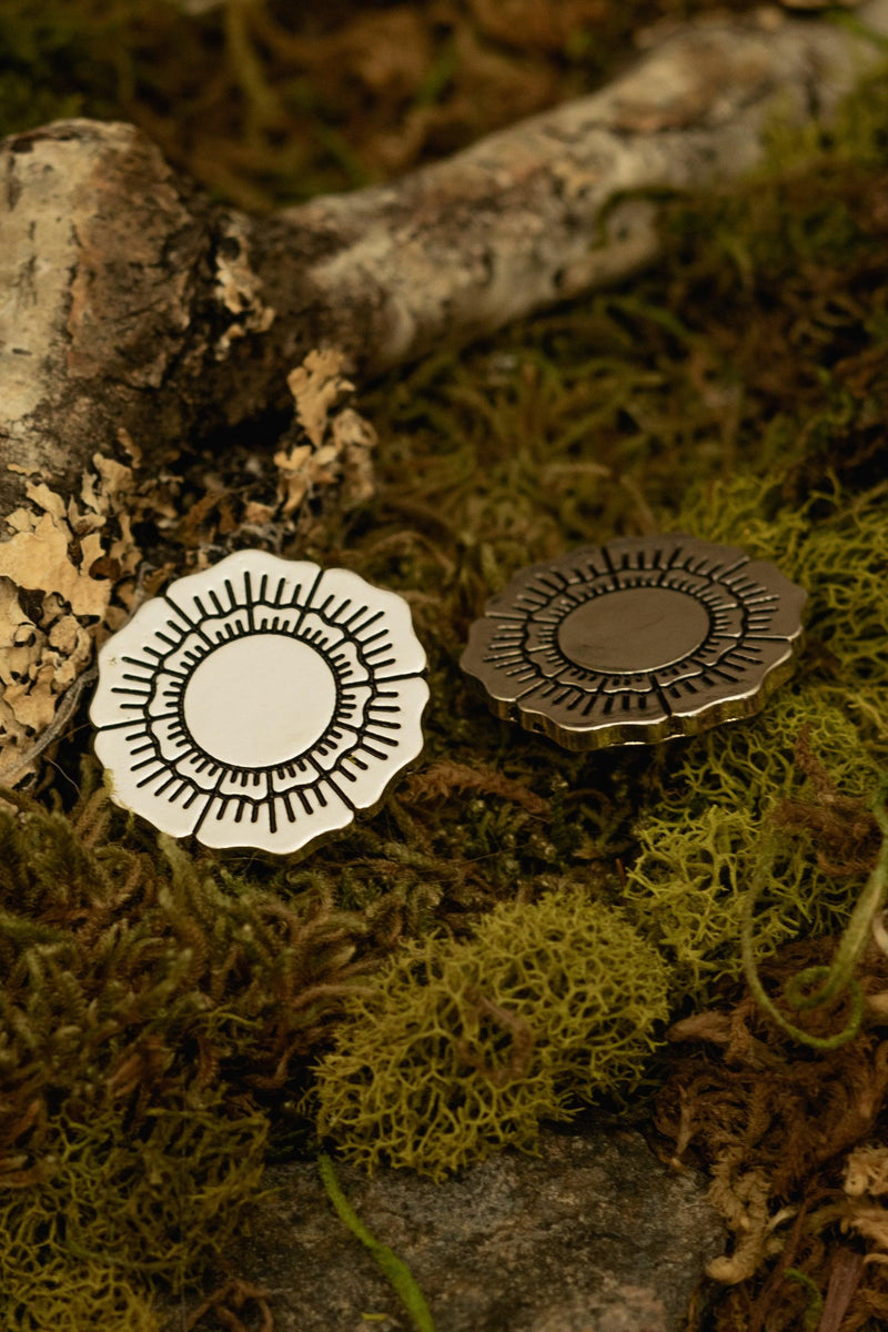Subtle and sophisticated Flower Collar Clips designed by artist Hilary Jane, featuring her signature botanical engraving in polished metal. These elegant collar accessories add a refined touch to any collared blouse or dress, pairing beautifully with the Dakota Dress, Jane Dress, or Katherine Dress for a timeless, feminine look.