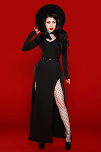 A luxurious Kassandra Maxi Dress made from a high-quality, ultra-stretchy poly blend that contours to the body, offering both comfort and elegance. This timeless piece features a deep low-cut neckline that enhances the décolletage and two thigh-high slits that strike the perfect balance between allure and sophistication.