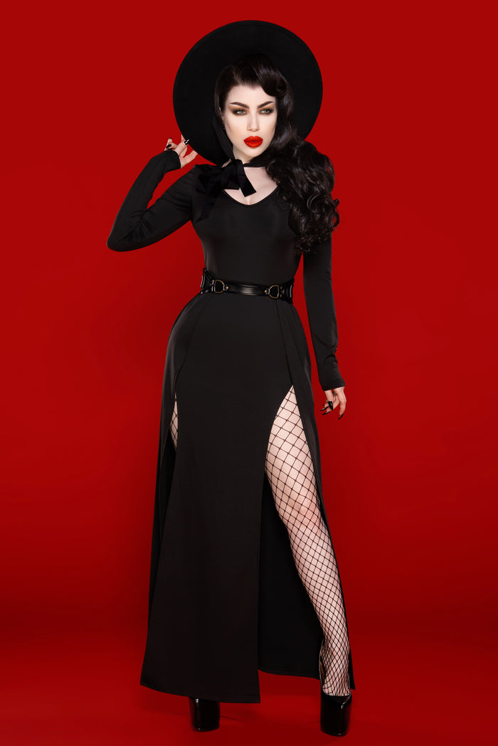 A luxurious Kassandra Maxi Dress made from a high-quality, ultra-stretchy poly blend that contours to the body, offering both comfort and elegance. This timeless piece features a deep low-cut neckline that enhances the décolletage and two thigh-high slits that strike the perfect balance between allure and sophistication.