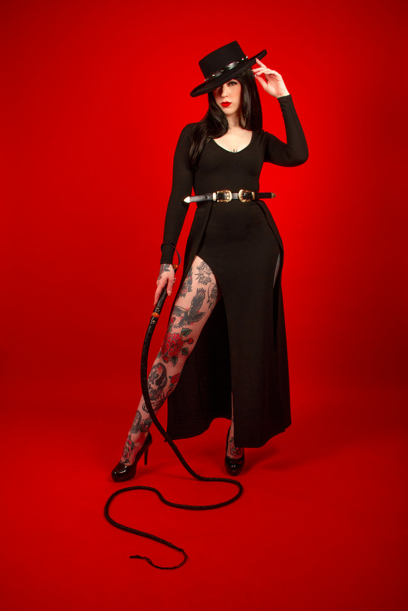 Designed for both comfort and allure, the Kassandra Maxi Dress features a silky poly blend fabric that stretches beautifully over the body. With two bold thigh-high slits and a flattering low neckline, it offers a perfect blend of sensuality and elegance for transitional wear.