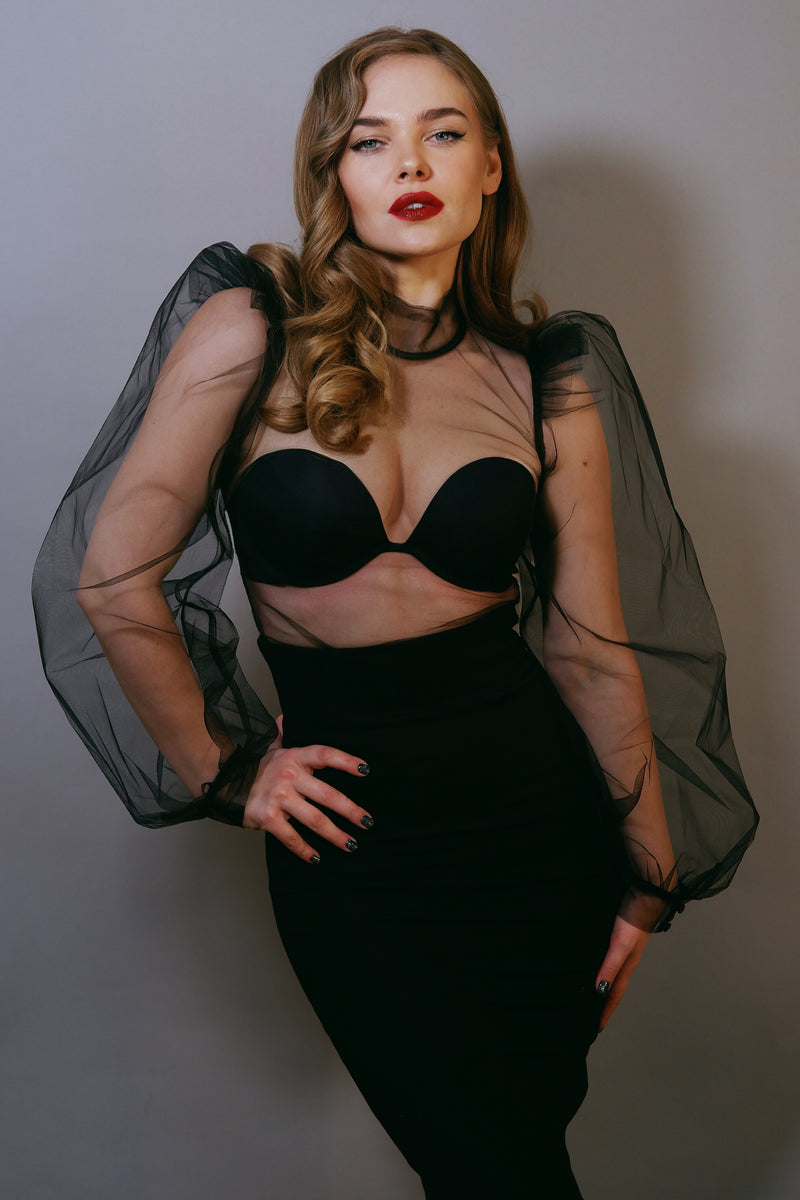 Gothic-inspired black chiffon blouse with see-through sheer panels, voluminous puff sleeves, high stiff collar, and structured shoulders, designed with a button-up back to provide an elegant, dramatic silhouette that elevates any formal or avant-garde outfit.