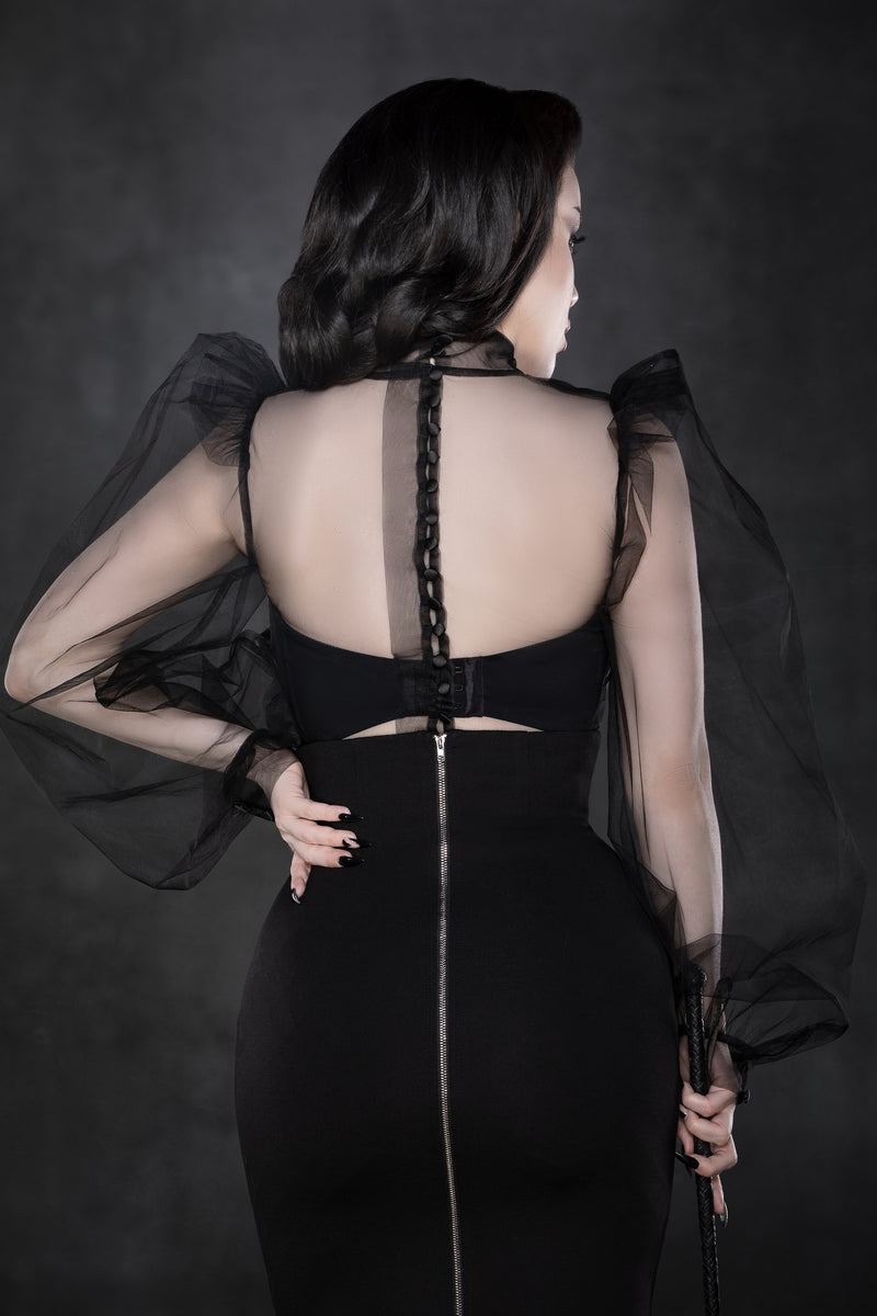 Elegant couture blouse in stiff, see-through black chiffon, with dramatic puff sleeves, high structured collar, and elevated shoulders, finished with a button-up back for a statement-making Gothic silhouette ideal for alternative fashion or formal occasions.