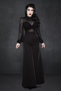 High-waisted Palazzo pants in classic black, featuring a flattering wide-leg silhouette inspired by 1940s fashion, crafted from lightweight crepe fabric with a touch of stretch for ease of movement, complete with two functional front pockets, making them perfect for versatile styling from workdays to casual evenings.