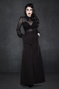 Black wide-leg Palazzo pants with a high-rise waist and chic 1940s-inspired design, made from lightweight crepe fabric with minimal stretch, featuring practical front pockets and a flowing silhouette, perfect for dressing up with heels or pairing with casual tops for a stylish day-to-night look.