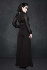 Black crepe Palazzo pants with a high waist and relaxed wide-leg silhouette, inspired by classic 1940s fashion, made from soft, slightly stretchy fabric, designed with two functional front pockets, offering a versatile and flattering fit suitable for work, casual outings, or weekend brunches.