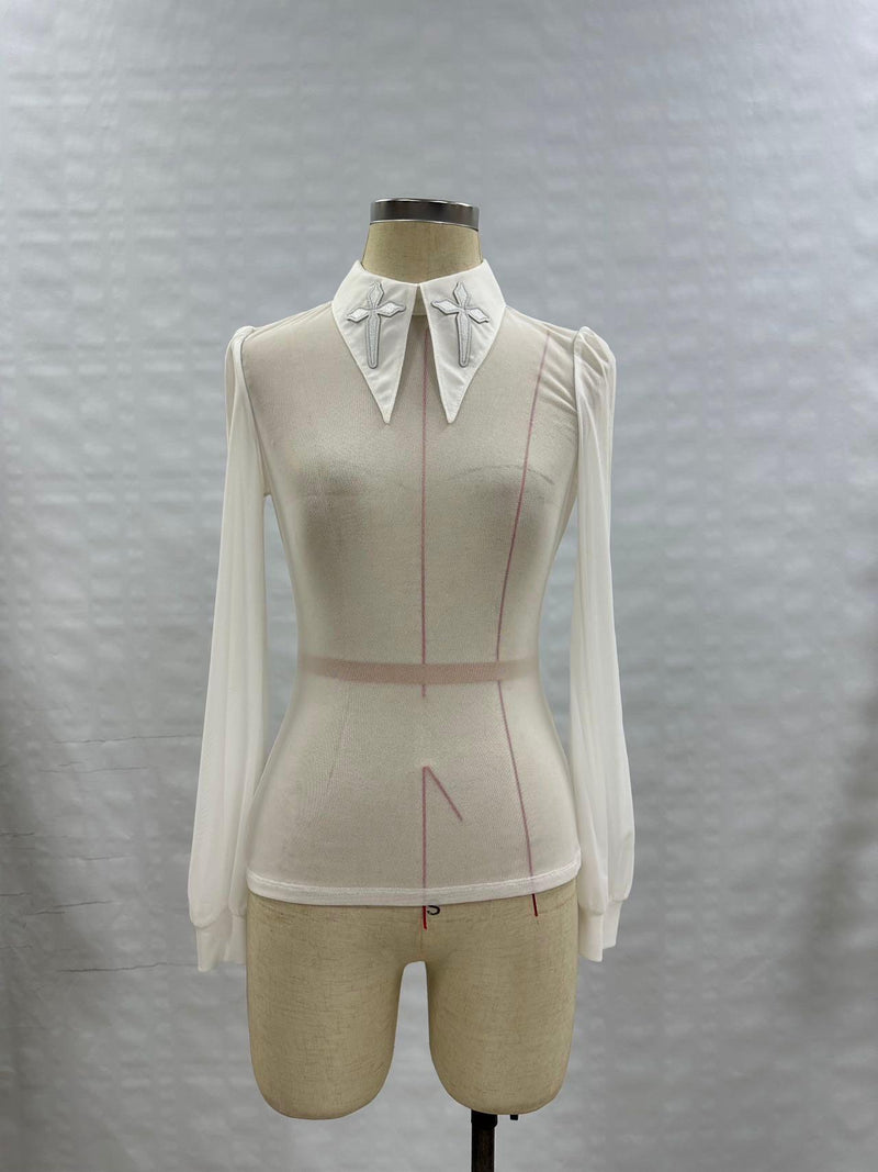 Gothic-inspired Personal Jesus top featuring long sleeves, semi-transparent soft mesh material, oversized embroidered crosses on an extended pointy collar, subtle back keyhole detail, and stretchy fabric for movement, perfect for edgy streetwear, festival styling, and club-ready fashion.