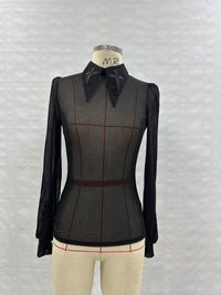 Bold semi-sheer mesh top with long sleeves, oversized embroidered crosses on an extended pointy collar, soft stretchy material, subtle back keyhole cut-out, and available in black, white, and electric purple, ideal for alternative fashion, edgy street style, and gothic club outfits.