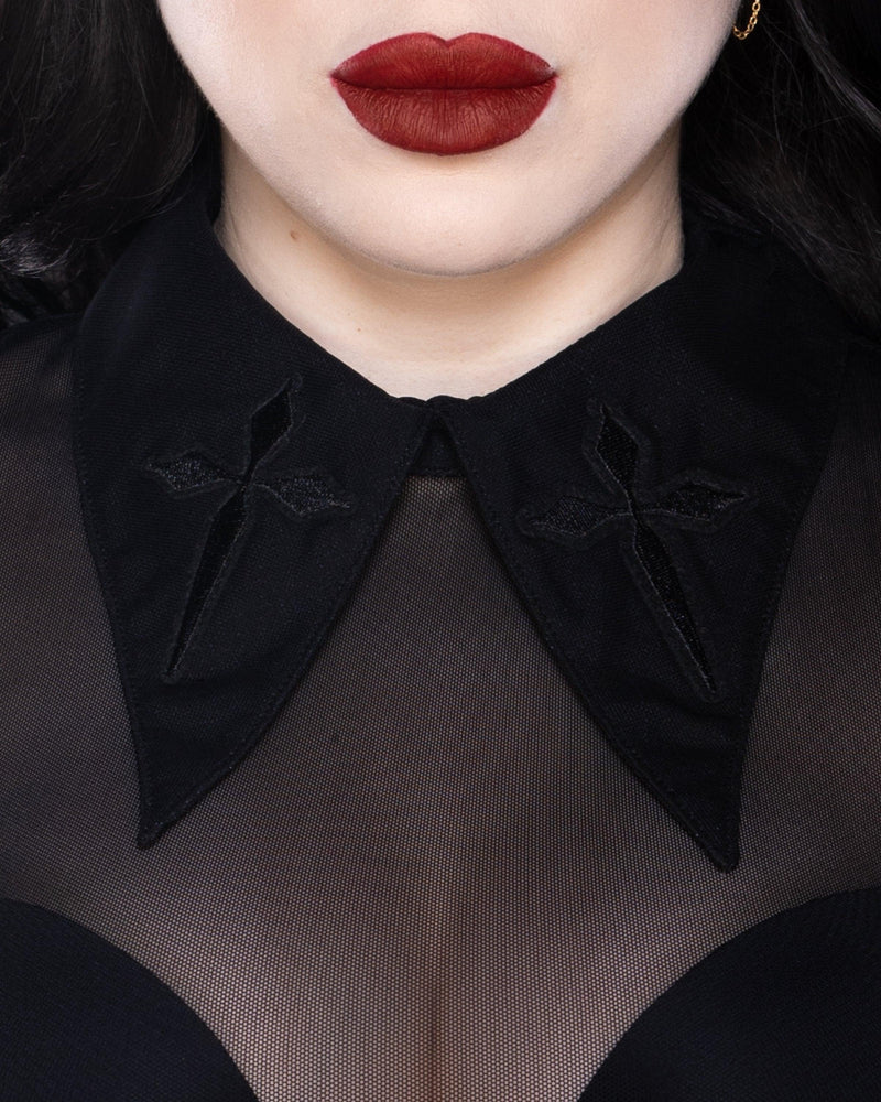 Personal Jesus long-sleeve mesh top featuring soft see-through fabric, oversized embroidered cross patches on an extended pointed collar, a subtle keyhole back for added allure, and stretchy material for comfort, available in bold black, virginal white, and electric purple, ideal for gothic fashion, alternative outfits, and nightlife looks.