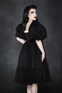 An ethereal, layered polka-dot dress featuring soft chiffon fabric for ultimate volume and movement. The empire waist and square neckline highlight the figure, while the ¾ puff sleeves enhance the dress’s romantic and classic aesthetic. This fully lined, knee-length dress combines gothic sweetness with timeless charm, making it perfect for spring picnics, date nights, or cottagecore-inspired outfits. Crafted from high-quality chiffon and bengaline materials.