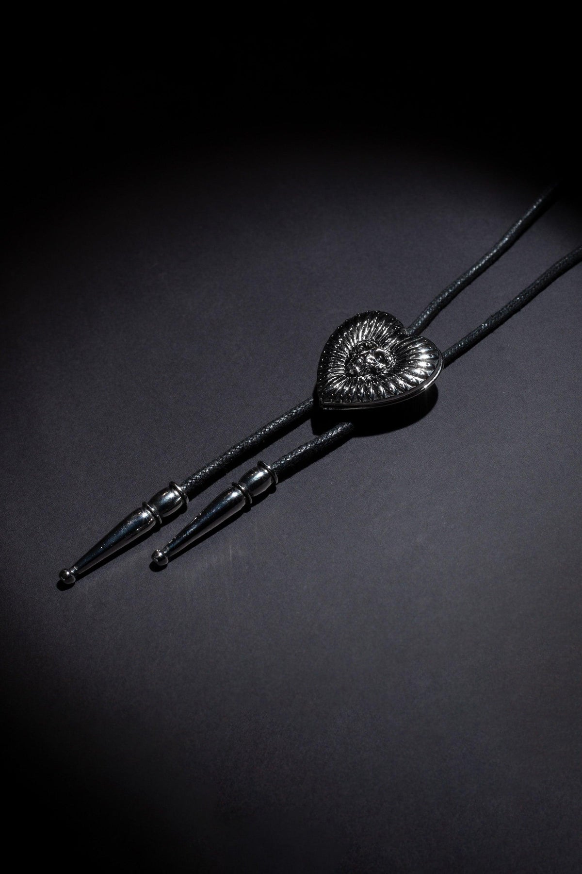 Handcrafted custom bolo tie with dual photo lockets and engraved brand logo, carefully made from durable, high-quality metals and leathers to ensure a refined finish and personal touch, ideal for weddings, anniversaries, or special events.