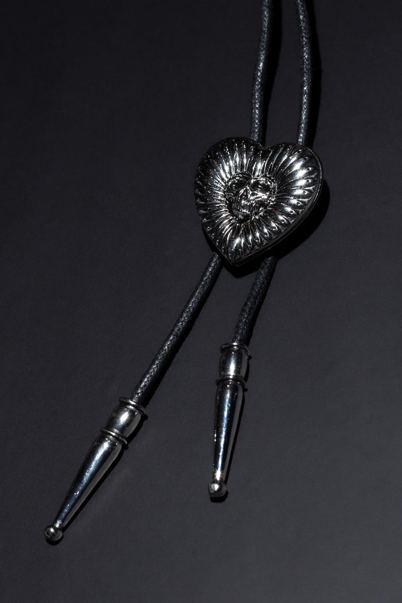 Custom-designed bolo tie with high-quality construction, twin memory lockets for photos, and engraved brand detailing, blending modern artistry with classic Western aesthetics for a one-of-a-kind accessory that celebrates craftsmanship and personal meaning.