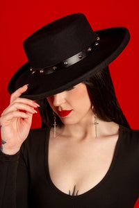 Vegan leather spiked hat belt with black strap and shiny silver spikes, designed to fit all hats on the site. Handcrafted and removable, this edgy accessory transforms plain hats into statement pieces for gothic, punk, or alternative fashion enthusiasts.