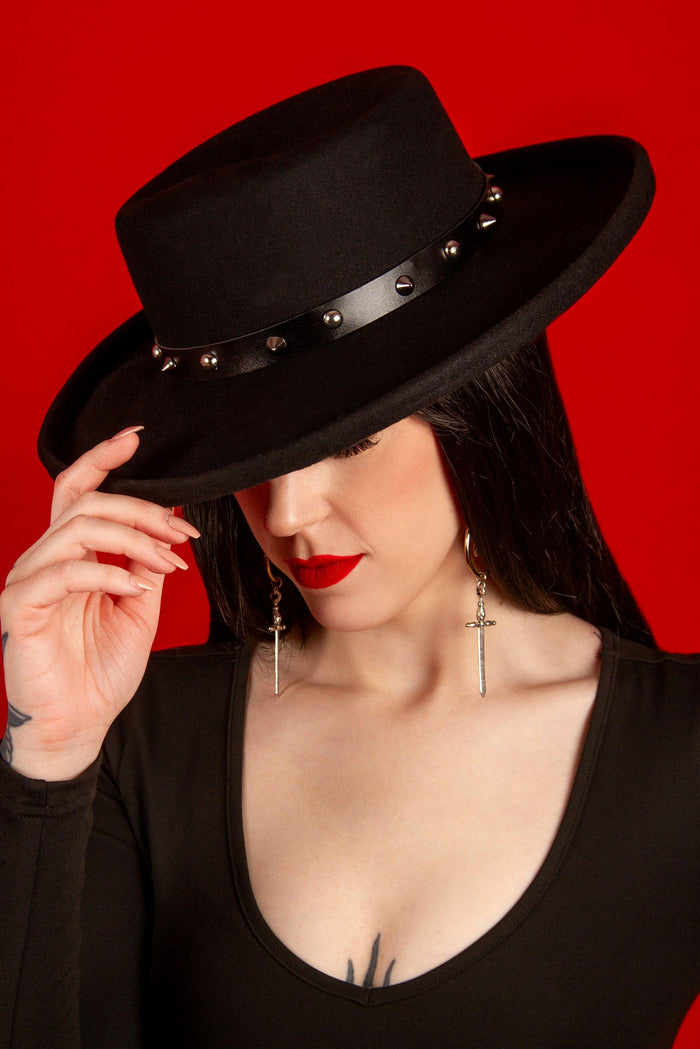 Vegan leather spiked hat belt with black strap and shiny silver spikes, designed to fit all hats on the site. Handcrafted and removable, this edgy accessory transforms plain hats into statement pieces for gothic, punk, or alternative fashion enthusiasts.